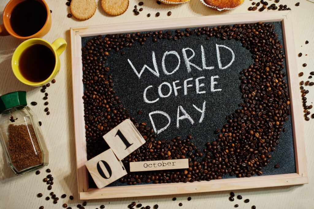 World coffe day words on blackboard flat lay.